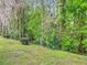 Landscape surrounding backyard and a retaining wall that is perfect for privacy at 13227 Molitor Ct, Hudson, FL 34669
