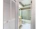 Bright bathroom featuring a tiled floor, glass shower, and a vanity with ample storage space at 13227 Molitor Ct, Hudson, FL 34669