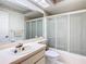Well-maintained bathroom with a combination tub and shower, and an updated vanity at 13227 Molitor Ct, Hudson, FL 34669