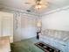 Comfortable bedroom featuring a closet, ceiling fan, and relaxed seating at 13227 Molitor Ct, Hudson, FL 34669