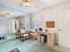 Bright bedroom with a desk, ceiling fan, and large mirrored wall at 13227 Molitor Ct, Hudson, FL 34669