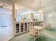 Inviting dining area adjacent to the kitchen, featuring a mirrored wall and built-in cabinetry for added storage at 13227 Molitor Ct, Hudson, FL 34669