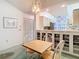 Cozy dining area connected to kitchen features built-in storage and bright lighting, enhancing the home's charm at 13227 Molitor Ct, Hudson, FL 34669