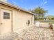Side patio featuring brick-paved flooring, a convenient side entrance, and ambient outdoor lighting for evening enjoyment at 13227 Molitor Ct, Hudson, FL 34669