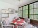 Enclosed lanai with large windows providing views of the home's backyard at 13227 Molitor Ct, Hudson, FL 34669