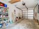 Organized garage with ample storage shelves and overhead door at 13227 Molitor Ct, Hudson, FL 34669