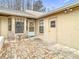 Cozy brick-paved patio with seating area, enclosed by white walls offering privacy and charm in this home at 13227 Molitor Ct, Hudson, FL 34669
