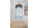 Inviting entryway showcasing a double door and decorative light fixture at 1528 Jutland Dr, Trinity, FL 34655