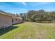 A spacious backyard provides ample space for outdoor activities and landscaping at 18251 East Rd, Hudson, FL 34667