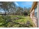 The fenced backyard offers ample space for outdoor activities and relaxation at 18251 East Rd, Hudson, FL 34667