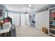Bright bedroom featuring neutral paint, a ceiling fan, and sliding glass door access to the exterior at 18251 East Rd, Hudson, FL 34667