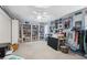 Spacious bedroom with an abundance of shelving, decor and natural light from large windows at 18251 East Rd, Hudson, FL 34667