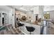 Modern kitchen featuring a breakfast bar, stainless steel appliances, and ample counter space at 18251 East Rd, Hudson, FL 34667