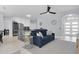 Open-concept living area boasts modern finishes, with easy access to the kitchen and front entry at 19123 Cherry Rose Cir, Lutz, FL 33558