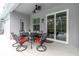 Charming outdoor patio featuring comfortable seating and a view of the screened-in pool at 19123 Cherry Rose Cir, Lutz, FL 33558