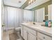 Bathroom featuring a shower/tub combo, patterned shower curtain, and spacious vanity at 215 Arbor Woods Cir, Oldsmar, FL 34677
