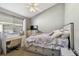 Bedroom with a vanity, a ceiling fan, and natural lighting at 215 Arbor Woods Cir, Oldsmar, FL 34677
