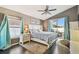 Bedroom with hardwood floors, a ceiling fan, and natural light at 215 Arbor Woods Cir, Oldsmar, FL 34677