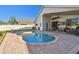Outdoor pool area surrounded by brick pavers, green grass, and lounge seating at 215 Arbor Woods Cir, Oldsmar, FL 34677