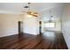 Spacious living room with beautiful wood flooring and high ceilings, creating an inviting atmosphere at 2333 Marietta Ave, Spring Hill, FL 34608