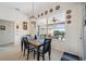 Inviting dining area with a view of the lanai and pool beyond through a large window at 2336 Edelweiss Loop, Trinity, FL 34655