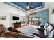 Bright living room with stylish ceiling, wood floors, and view of the outdoor pool at 2336 Edelweiss Loop, Trinity, FL 34655