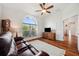 Bright living room featuring wood floors, a large window, and comfortable seating at 2336 Edelweiss Loop, Trinity, FL 34655