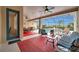 Inviting covered patio with comfortable seating, a ceiling fan, and views of the screened pool area at 2336 Edelweiss Loop, Trinity, FL 34655