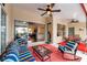 Comfortable seating area on a covered patio, ideal for outdoor relaxation and entertaining at 2336 Edelweiss Loop, Trinity, FL 34655