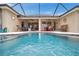Inviting screened pool with a relaxing patio area for outdoor dining and lounging at 2336 Edelweiss Loop, Trinity, FL 34655