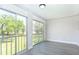 The balcony features an outdoor view, sliding glass doors, and new gray flooring at 2464 Australia E Way # 46, Clearwater, FL 33763