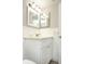 Well-lit bathroom featuring a modern vanity, sink, and ample storage space at 2464 Australia E Way # 46, Clearwater, FL 33763