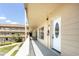 Condo exterior hallway featuring well-maintained grounds and unit entrances at 2464 Australia E Way # 46, Clearwater, FL 33763