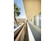 Exterior condominium hallway featuring a view of the grounds and ample natural light at 2464 Australia E Way # 46, Clearwater, FL 33763