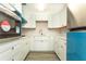 Spacious kitchen with white cabinets and modern appliances, perfect for cooking and entertaining at 2464 Australia E Way # 46, Clearwater, FL 33763