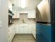 Bright kitchen with white cabinets, modern appliances, and plenty of counter space for cooking at 2464 Australia E Way # 46, Clearwater, FL 33763