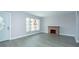 Sunlit living room with new wood-look flooring, fireplace, and modern design, perfect for relaxing and entertaining at 2464 Australia E Way # 46, Clearwater, FL 33763