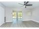 Spacious living room with neutral tones and a view to an outdoor space at 2464 Australia E Way # 46, Clearwater, FL 33763