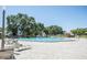 Resort-style pool area with sun loungers, lush greenery, and a serene atmosphere for relaxation and recreation at 2464 Australia E Way # 46, Clearwater, FL 33763