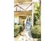 Exterior view of a condo stairway showing the entrance and well-maintained landscaping at 2464 Australia E Way # 46, Clearwater, FL 33763