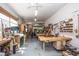Spacious workshop featuring worktables, tools, natural light, and ample room for projects and hobbies at 2464 Australia E Way # 46, Clearwater, FL 33763