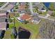 A lovely home with a screened-in pool, lush green lawn, and a tranquil pond in a beautiful neighborhood at 3042 Gianna Way, Land O Lakes, FL 34638
