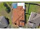 Aerial view of a single-Gathering home with a pool and a fenced backyard in a residential neighborhood at 3042 Gianna Way, Land O Lakes, FL 34638
