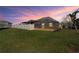 Spacious backyard featuring a screened-in patio, offering a relaxing outdoor living space at 3042 Gianna Way, Land O Lakes, FL 34638