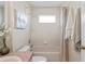 Cozy bathroom with a shower-tub combo and decorative accents at 3042 Gianna Way, Land O Lakes, FL 34638