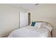 Bedroom featuring a bed with white bedding and simple decor at 3042 Gianna Way, Land O Lakes, FL 34638