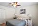 Cozy bedroom featuring a ceiling fan and comfortable decor at 3042 Gianna Way, Land O Lakes, FL 34638