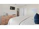Bedroom with dresser, TV, and comfortable bed at 3042 Gianna Way, Land O Lakes, FL 34638