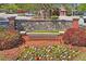 Beautiful Ballantrae Park neighborhood entrance with stone details and lush landscaping at 3042 Gianna Way, Land O Lakes, FL 34638