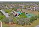 Aerial view of the community pool, tennis courts, and recreation area at 3042 Gianna Way, Land O Lakes, FL 34638